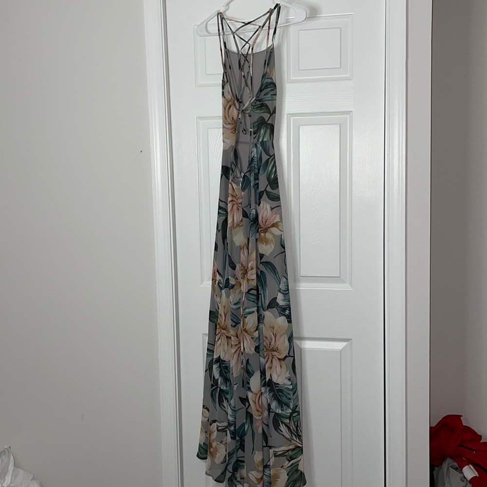 Floor length floral dress. Criss cross, strappy back, with zipper and tie.